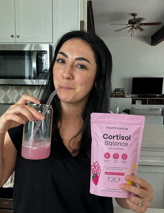 A customer drinking Hormoona Cortisol Balance Raspberry Lemonade mixed in water